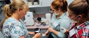 Students learn how to work with dental alginate.