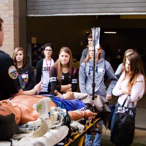 A paramedic gives students a tour of his emergency vehicle.